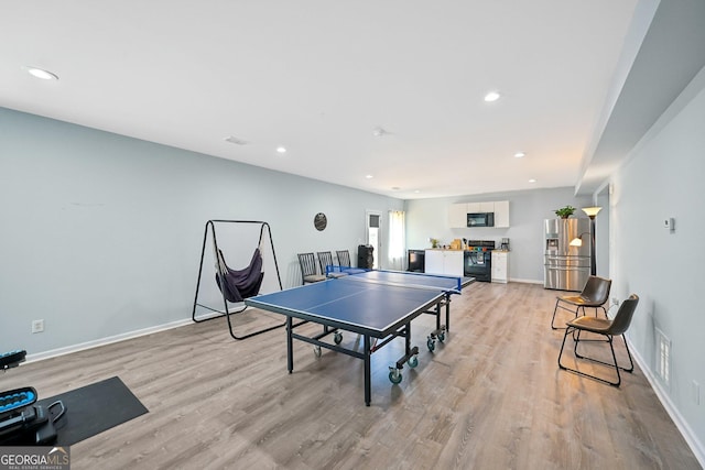 rec room featuring baseboards, recessed lighting, visible vents, and light wood-style floors