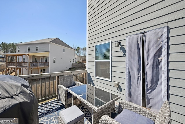 balcony featuring a residential view and a grill