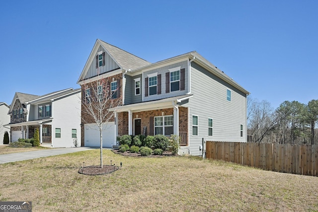 traditional home with a garage, concrete driveway, fence, board and batten siding, and a front yard