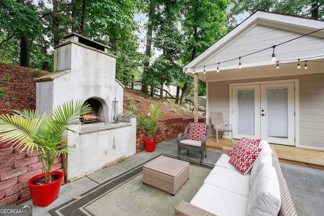 view of patio / terrace with an outdoor living space with a fireplace