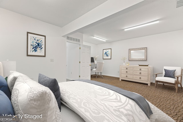 bedroom with visible vents, carpet floors, and baseboards