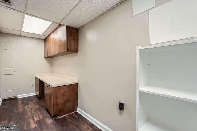 laundry room featuring dark wood-style floors, laundry area, visible vents, and baseboards