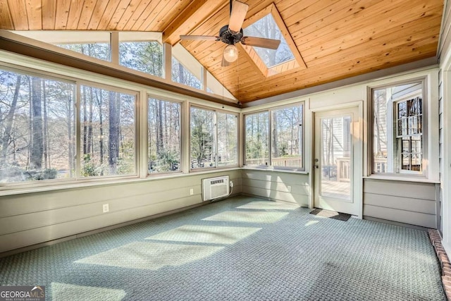 unfurnished sunroom featuring vaulted ceiling with skylight, a wall unit AC, wood ceiling, and a ceiling fan