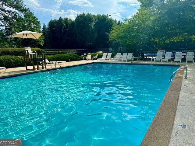 community pool featuring fence