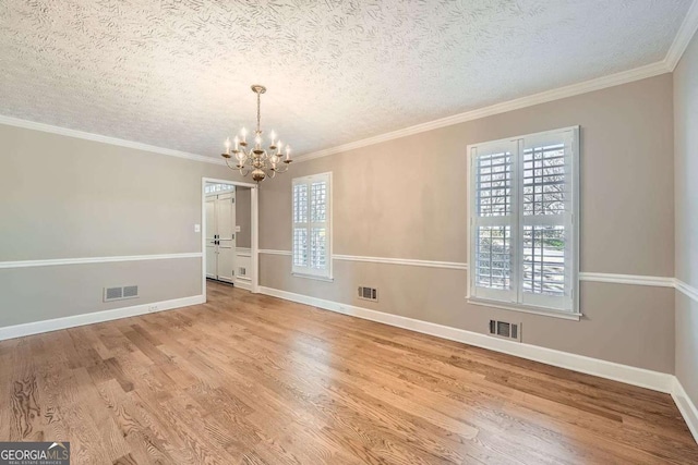 interior space featuring a wealth of natural light, wood finished floors, and visible vents