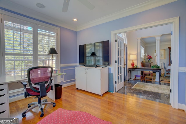 office featuring ornamental molding, wainscoting, decorative columns, and light wood finished floors