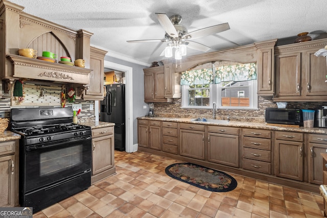 kitchen featuring a textured ceiling, a sink, ornamental molding, black appliances, and tasteful backsplash