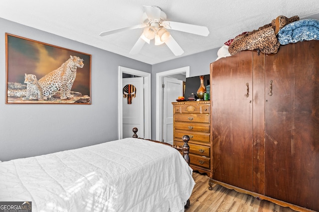 bedroom featuring a ceiling fan and wood finished floors