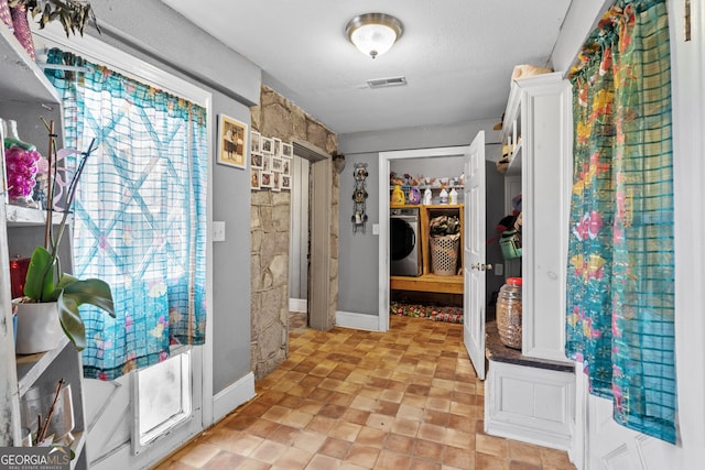 walk in closet featuring washer / clothes dryer and visible vents