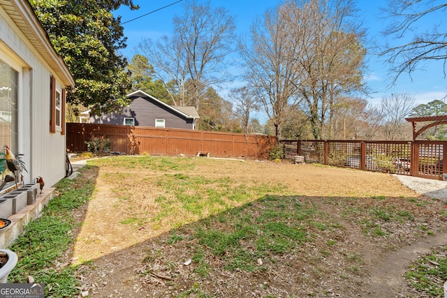 view of yard with a fenced backyard