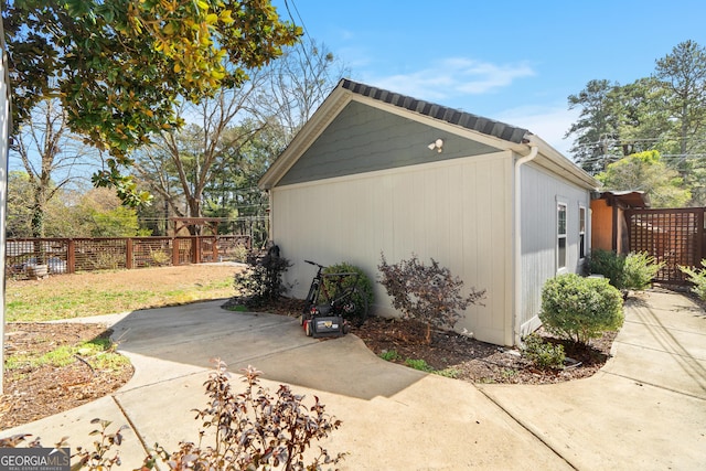 view of home's exterior featuring a patio area and fence