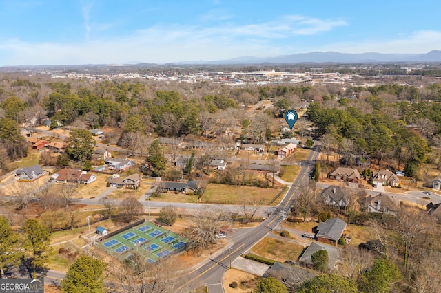 birds eye view of property featuring a mountain view