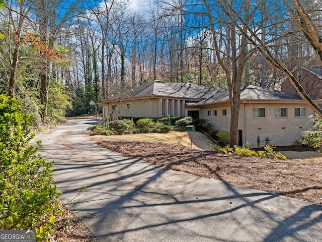 view of side of home with brick siding