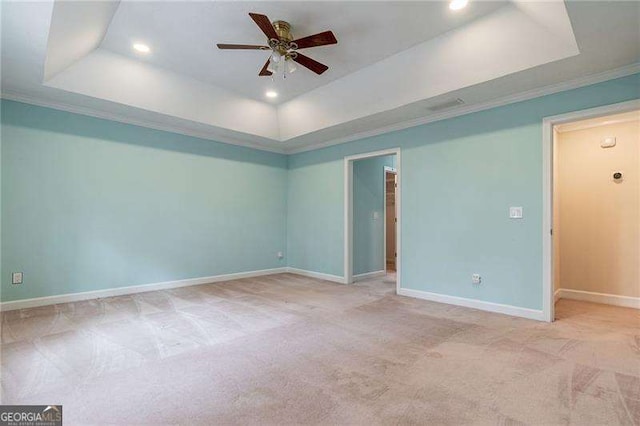 carpeted spare room featuring a tray ceiling, ceiling fan, baseboards, and recessed lighting