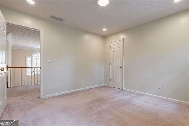 unfurnished room featuring recessed lighting, visible vents, light carpet, and baseboards