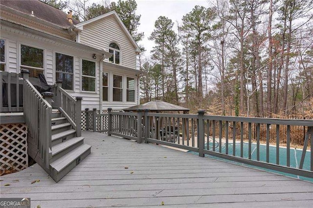 deck with a fenced in pool