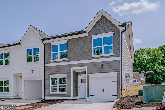 view of front of house with a garage and concrete driveway