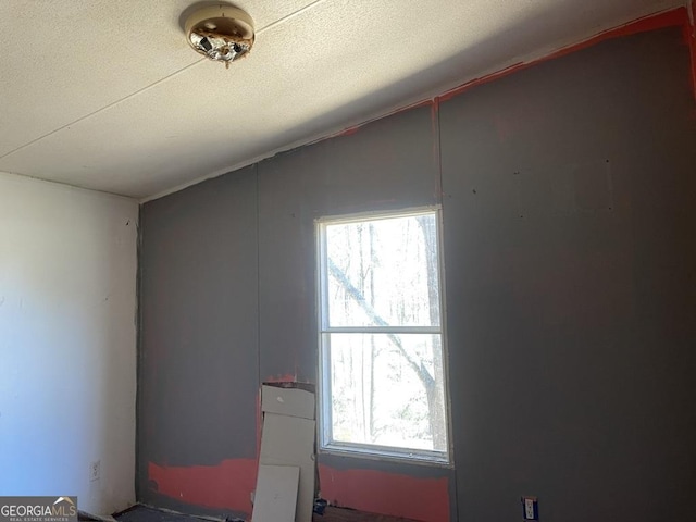 interior details featuring a textured ceiling