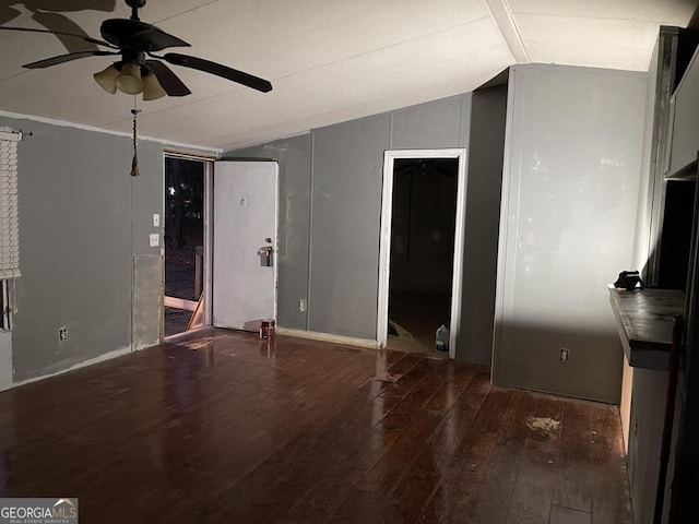 interior space featuring vaulted ceiling, ceiling fan, and hardwood / wood-style flooring