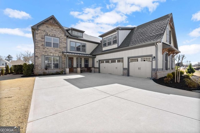 view of front of home featuring roof with shingles, brick siding, an attached garage, board and batten siding, and driveway