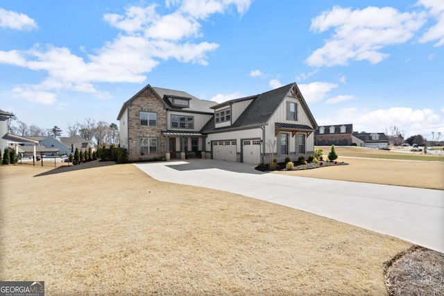 view of front of home featuring metal roof, an attached garage, driveway, stone siding, and a standing seam roof