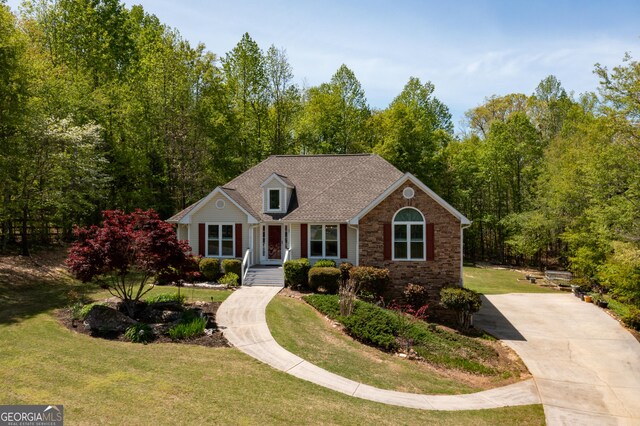 6935 Autumn Hills Dr, Cumming, GA 30028 - view of front facade with stone siding, a front lawn, and a shingled roof