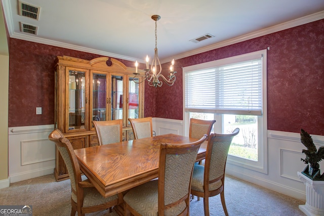 6935 Autumn Hills Dr, Cumming, GA 30028 - dining area featuring a chandelier, visible vents, a wainscoted wall, and light colored carpet