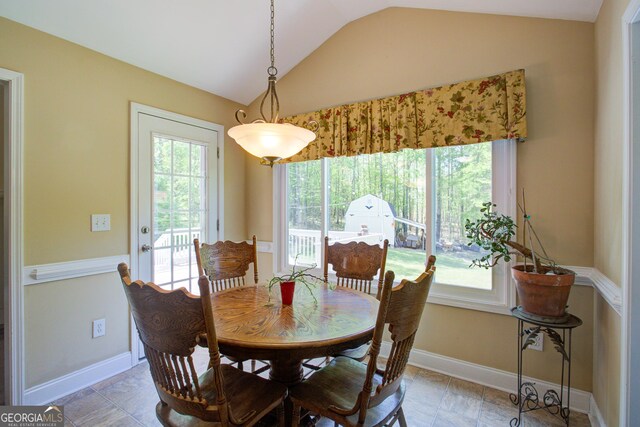 6935 Autumn Hills Dr, Cumming, GA 30028 - dining area featuring lofted ceiling and baseboards