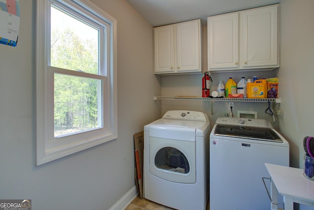 6935 Autumn Hills Dr, Cumming, GA 30028 - washroom with cabinet space, baseboards, and washer and clothes dryer