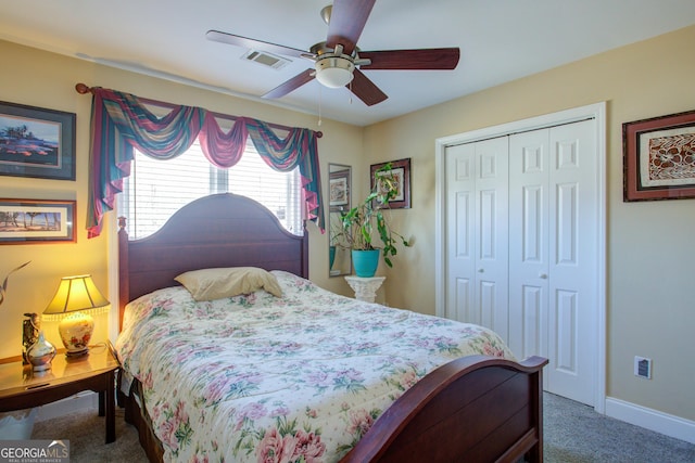 bedroom featuring visible vents, a ceiling fan, a closet, carpet floors, and baseboards