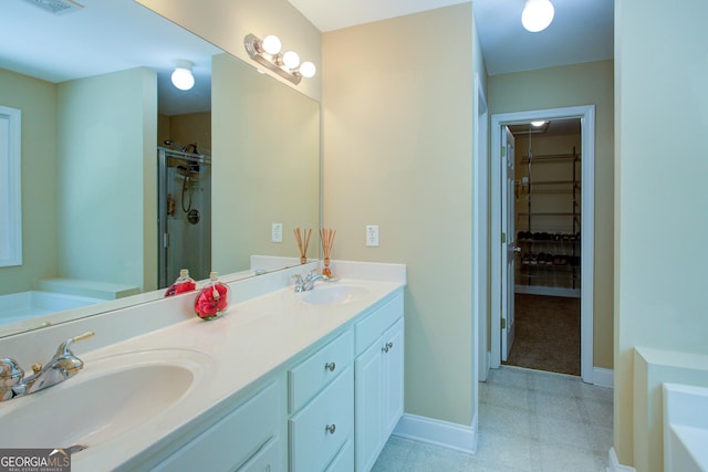 6935 Autumn Hills Dr, Cumming, GA 30028 - full bathroom with visible vents, double vanity, a garden tub, and a sink