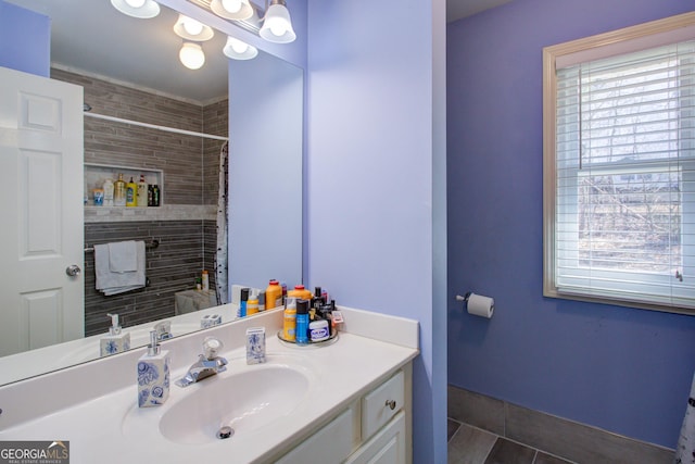 full bathroom with tile patterned floors, vanity, and a shower with shower curtain