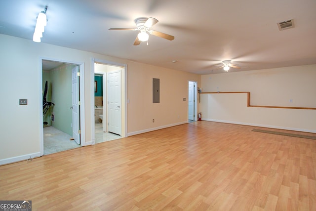 6935 Autumn Hills Dr, Cumming, GA 30028 - empty room featuring electric panel, light wood-style flooring, visible vents, and ceiling fan