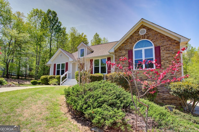 6935 Autumn Hills Dr, Cumming, GA 30028 - ranch-style home featuring a front lawn, stone siding, and a shingled roof