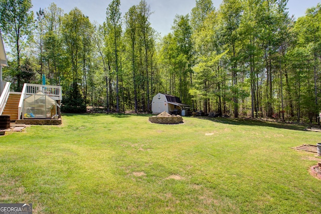 6935 Autumn Hills Dr, Cumming, GA 30028 - view of yard featuring an outdoor structure, central AC unit, a shed, and a greenhouse