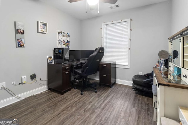 office with visible vents, wood finished floors, a ceiling fan, and baseboards