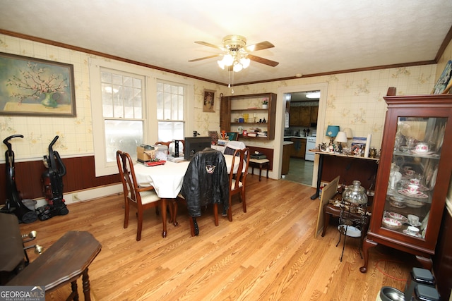 49 Thompson Rd, Lagrange, GA 30240 - dining area featuring crown molding, wallpapered walls, light wood finished floors, and ceiling fan