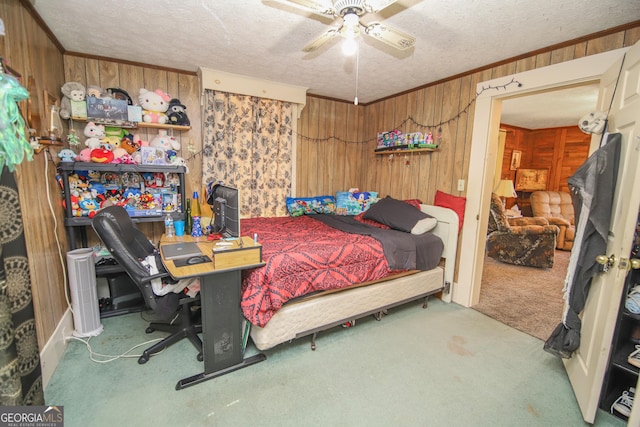 49 Thompson Rd, Lagrange, GA 30240 - carpeted bedroom featuring wooden walls, a textured ceiling, crown molding, and a ceiling fan