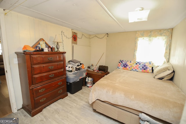 bedroom with light wood-type flooring