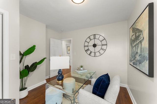 office space with wood finished floors and baseboards