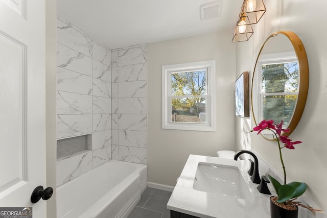 full bathroom featuring tile patterned floors, visible vents, baseboards, and vanity