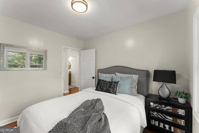 bedroom featuring baseboards