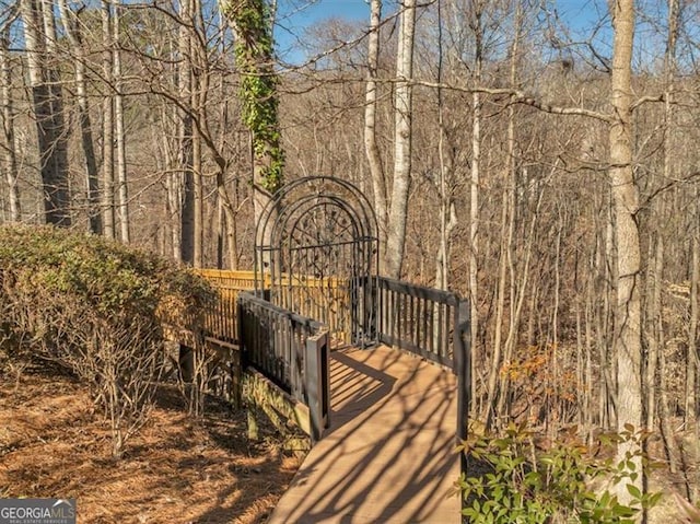 3460 Mansions Pkwy, Berkeley Lake, GA 30096 - view of community with a wooded view