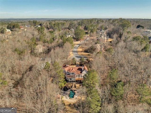 drone / aerial view with a view of trees