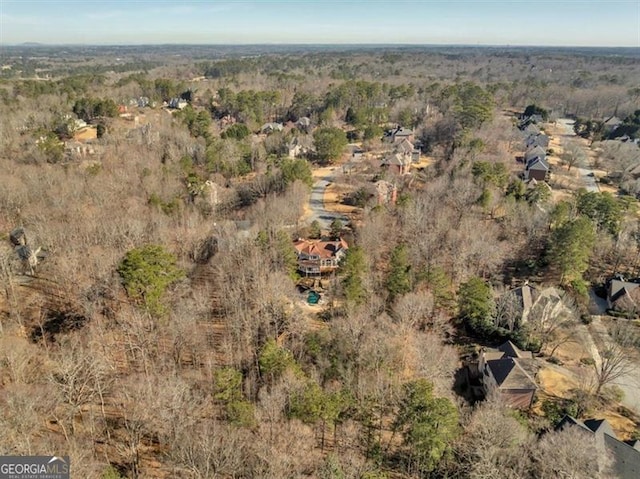 bird's eye view featuring a forest view