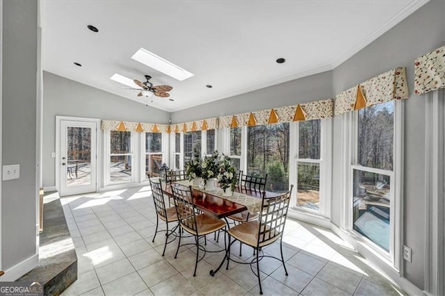 sunroom / solarium with vaulted ceiling with skylight and ceiling fan