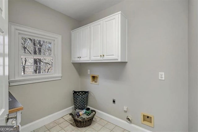 laundry area with hookup for a washing machine, baseboards, gas dryer hookup, hookup for an electric dryer, and cabinet space