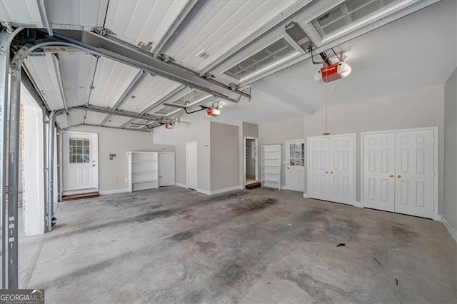 garage featuring baseboards and a garage door opener