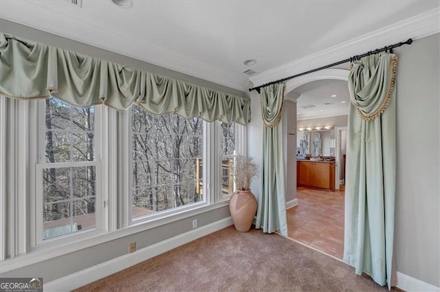 3460 Mansions Pkwy, Berkeley Lake, GA 30096 - carpeted spare room featuring ornamental molding, arched walkways, and tile patterned floors
