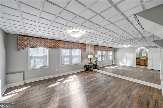 3460 Mansions Pkwy, Berkeley Lake, GA 30096 - unfurnished living room with baseboards and wood finished floors